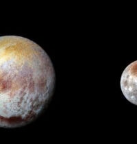 Charon’s Red Polar Cap Is Built From Pluto’s Own Escaping Atmosphere